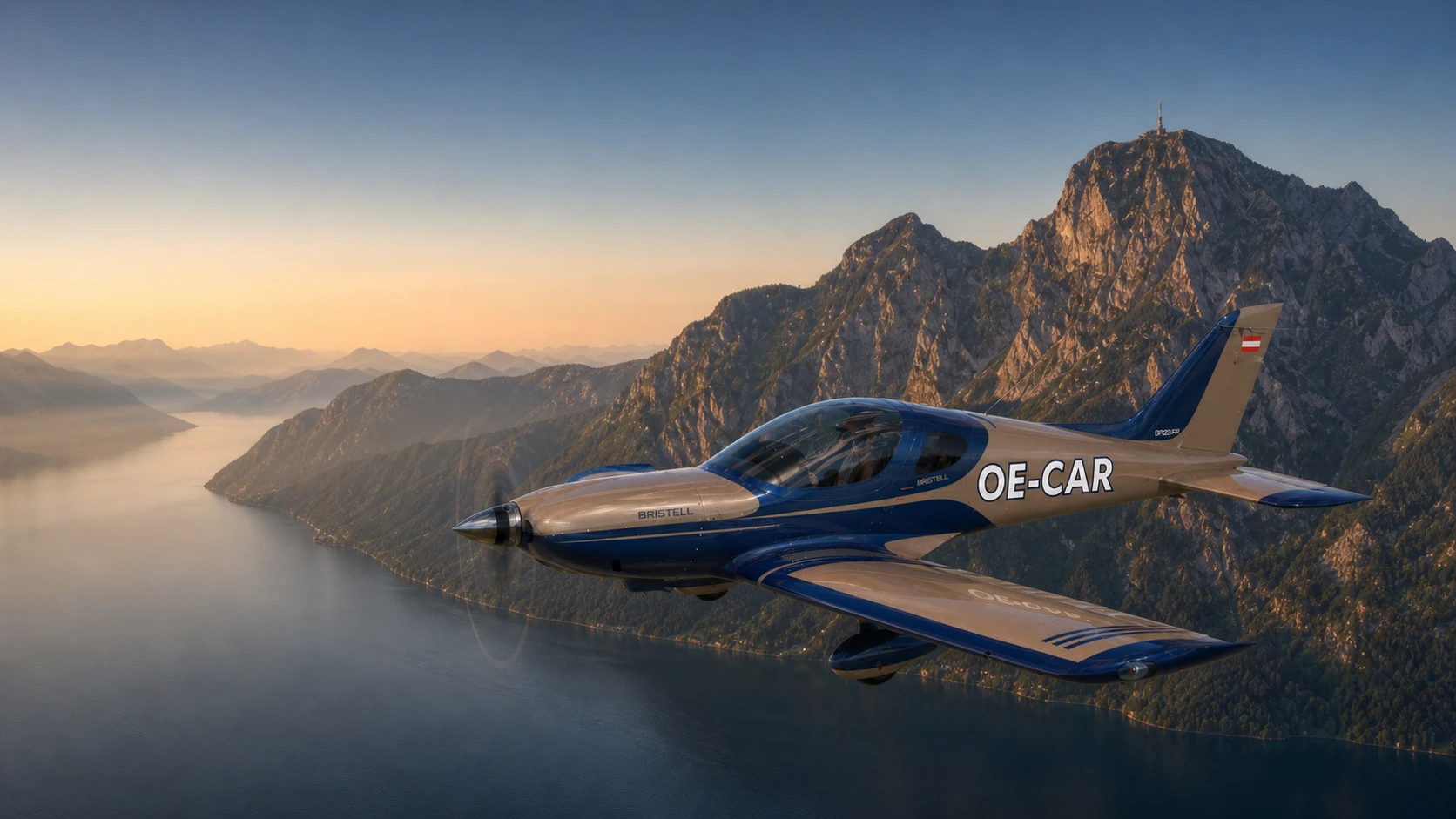 Visualisation of Bristell OE-CAR in navy and champagne over Lake Traunsee
